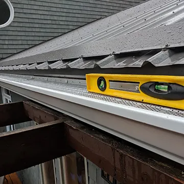 Eavestroughing on metal roofs